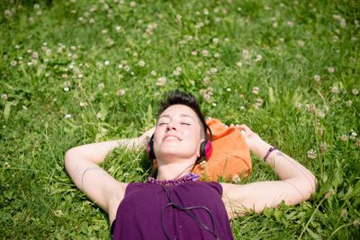 beautiful hipster short hair woman listening music in the...