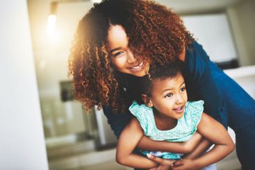 Fun, mom and child in home, bonding and laughing in...