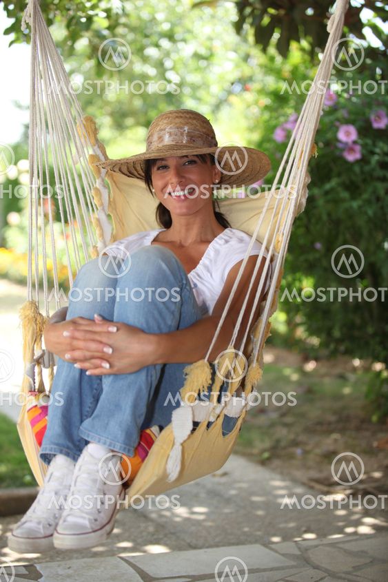 young woman resting in a hammock