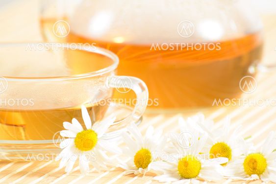 teacup with herbal chamomile tea