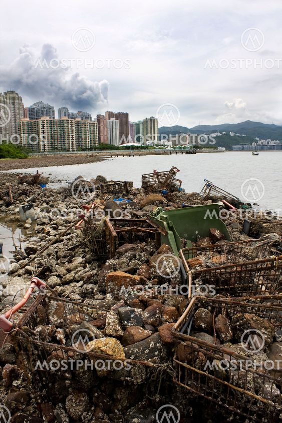 Garbage piled up on the coast of the ocean.