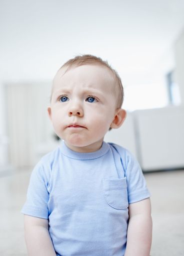 Baby boy, infant and wonder in home, floor and confused...