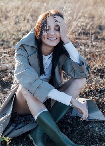 Beautiful fashionable brunette woman in gray coat...