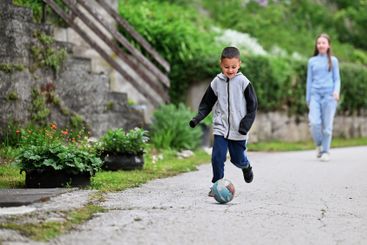 Children playing together in a park or engaging in a game.