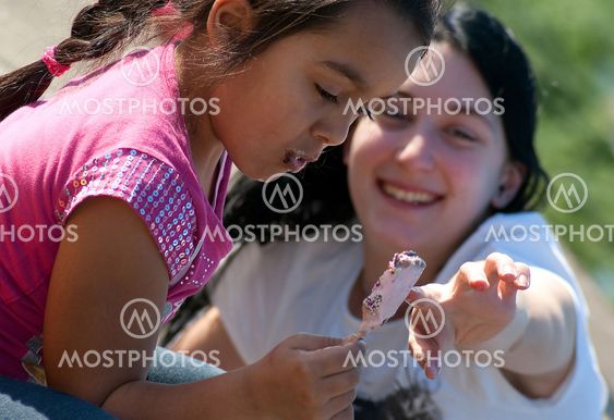 Little girl and woman play fighting