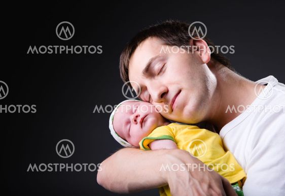 Happy young father and newborn girl