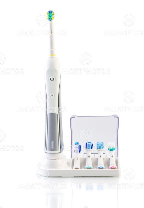 White Electric Toothbrush with stand charger on white