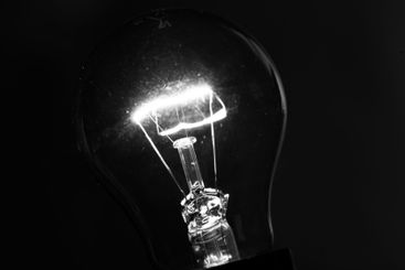 Close-up of electrical bulb on black background