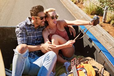 Selfie, road trip and couple with journey, love and...