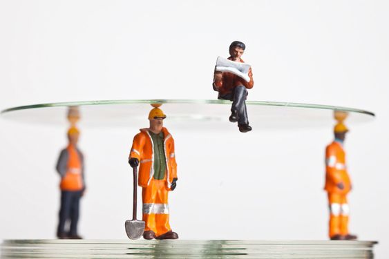 Miniature people in action with CDs