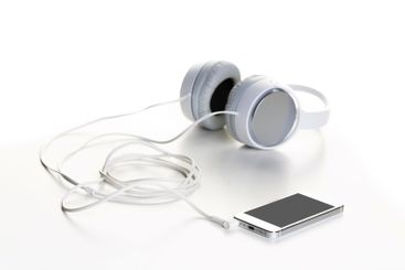 White headphones on white background close up