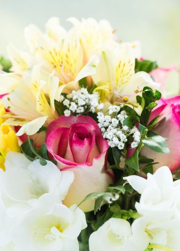Beautiful floral arrangement featuring pink roses,...