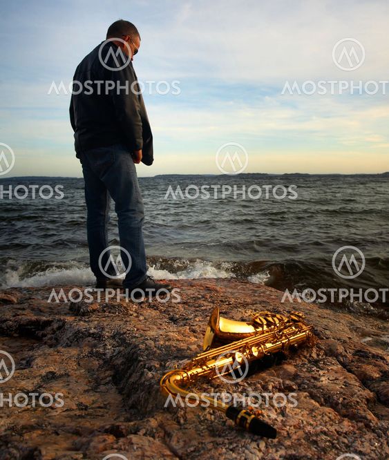 Musicians and saxophone at the seaside