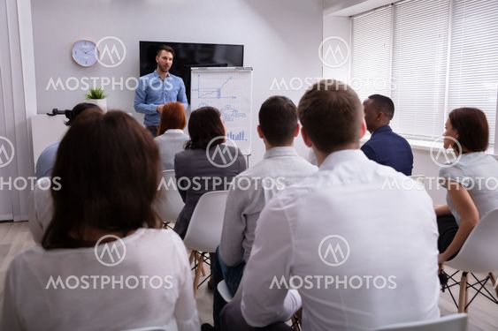 Businessman Giving Presentation To His Colleagues