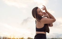 Woman dancing in meadow