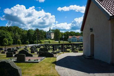 Cemetery in Scandinavia, Many dark gravestones on the...