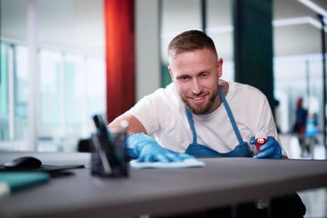 Janitor Cleaning White Desk