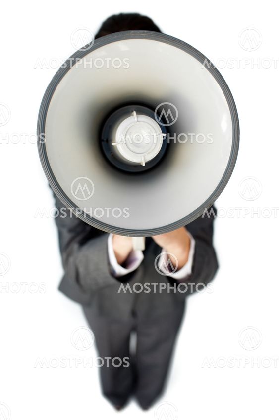 Businesswoman giving instructions with a megaphone