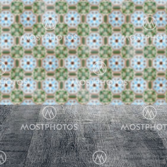 Wood table top and blur vintage ceramic tile pattern wall