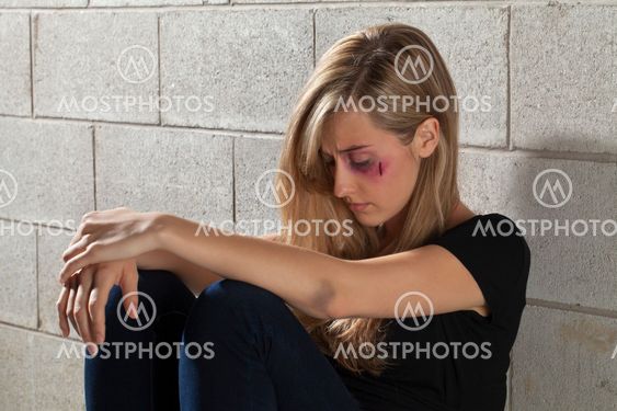 a wounded battered woman