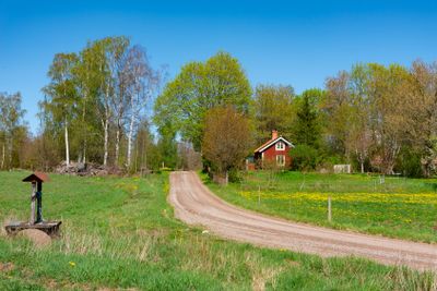 Red wooden cottage in Småland in Spring