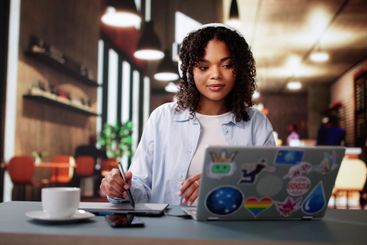 African American Designer Using Laptop Computer