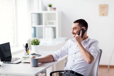 businessman calling on smartphone at office