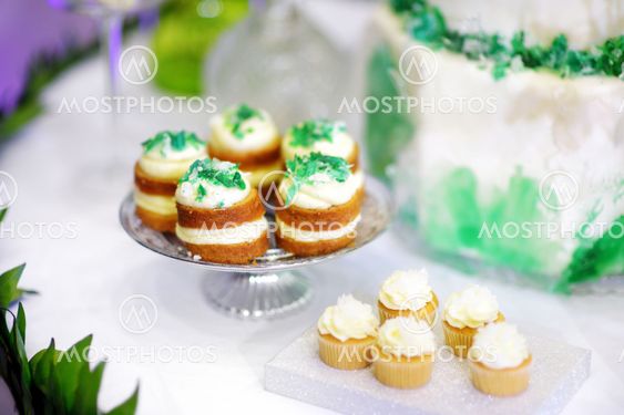 Three delicious green cupcakes on dessert table