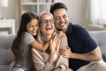 Young son preteen age grandkid cuddle to beloved mommy...