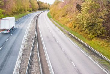 HGV vehicle on a dual carriageway - motorway traffic in...
