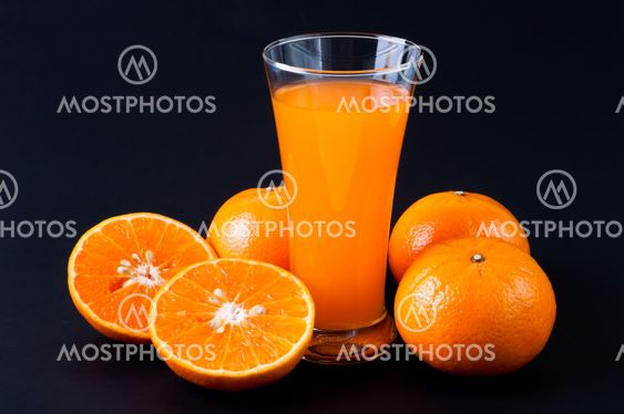Orange juice glass and orange fruit
