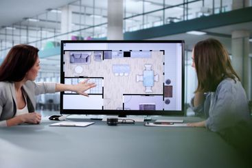 Female Property Assessor managing online house...