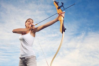 Woman practicing with bow and arrow