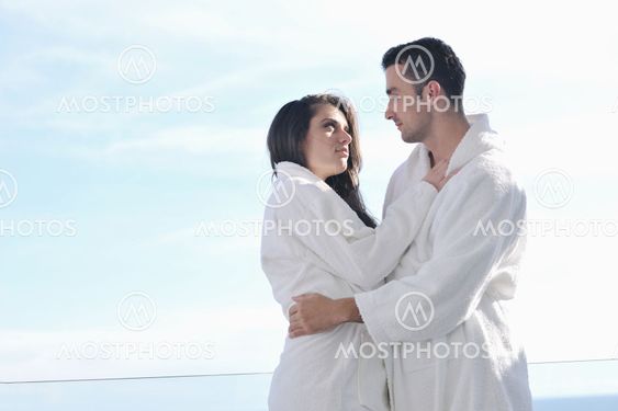 couple relaxing on balcony