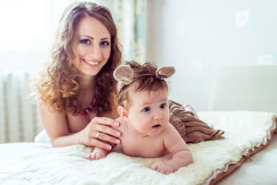 naked baby with mother