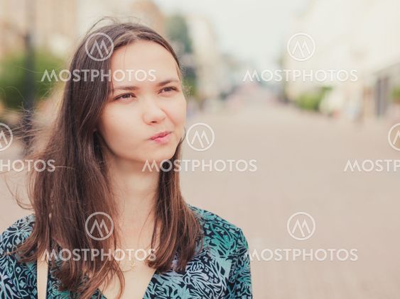 displeased handsome young woman looking away