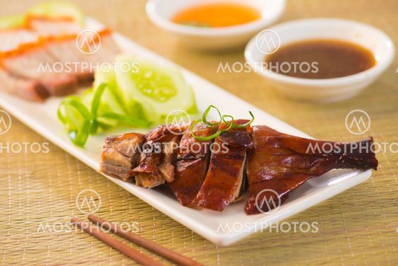 Roasted duck, Chinese style , drumstick and chopstick