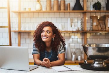 Laptop, thinking and woman with notebook in kitchen for...