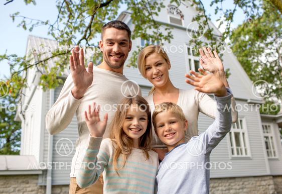 happy family in front of house outdoors