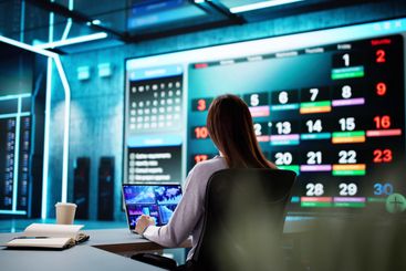 Busy businesswoman organizing appointments and schedules