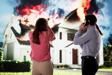 The firefighter battles the natural wildfire, protecting...