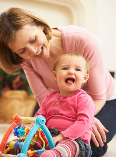 Mother And Daughter Playing