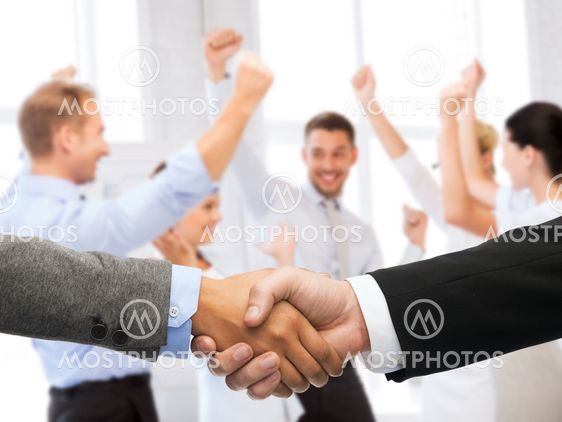 businessman and businesswoman shaking hands