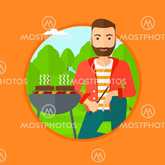 Man cooking meat on barbecue.