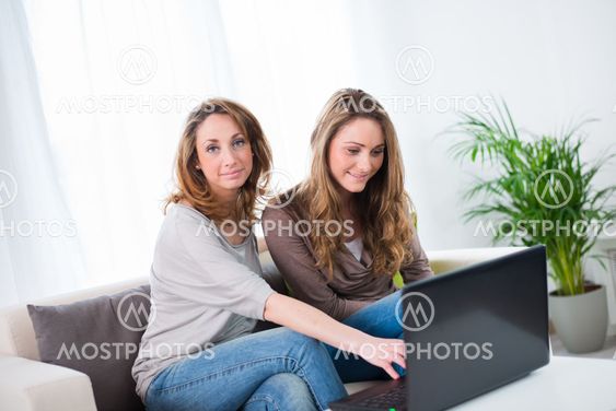 portrait of two beautiful girls at home