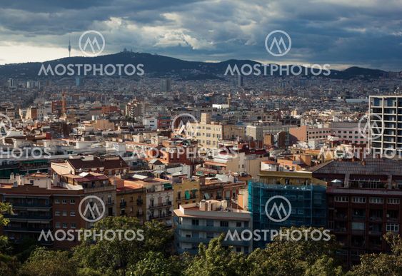 Barcelona city under cloudy sky overview