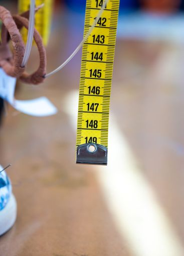 Tape measure ribbon in yellow using centimeters for a...