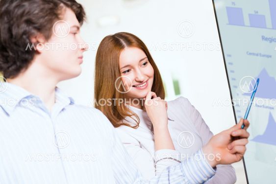 business woman with a colleague discussing reports