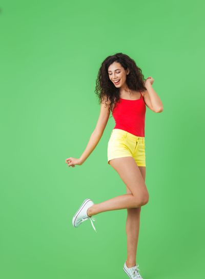 Full length portrait of fitness girl 20s dressed in...