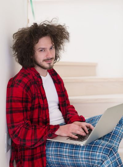 freelancer in bathrobe working from home